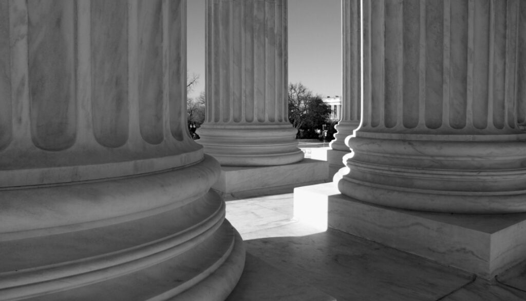 United States Supreme Court columns in black and white.